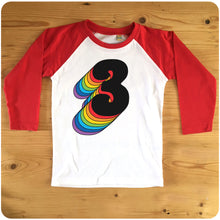 Load image into Gallery viewer, Third Birthday Three Raglan T-Shirt With Retro Rainbow Drop Shadow available in red or blue